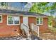 Close up of front of brick home showing entrance with white door and small brick staircase at 764 Emorywood Ln, Rock Hill, SC 29730
