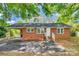 Charming brick home with a covered carport and mature trees at 764 Emorywood Ln, Rock Hill, SC 29730