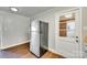 Kitchen includes wood flooring, stainless steel refrigerator, white door and neutral wall colors at 764 Emorywood Ln, Rock Hill, SC 29730