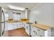 Bright kitchen with white cabinetry, wood countertops, and stainless steel appliances at 764 Emorywood Ln, Rock Hill, SC 29730