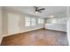 Well-lit living room with wood flooring, ceiling fan, and neutral wall colors at 764 Emorywood Ln, Rock Hill, SC 29730