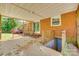 Brick home featuring a screened porch and access to the basement stairs at 764 Emorywood Ln, Rock Hill, SC 29730