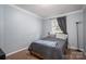 Bedroom featuring window, lamp and carpeted floor at 7790 Caswell Rd, Stanley, NC 28164