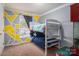 Bedroom featuring bunkbeds and window with view to outside at 7790 Caswell Rd, Stanley, NC 28164