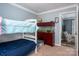 Bedroom featuring bunkbeds, fish tank and view to adjacent room at 7790 Caswell Rd, Stanley, NC 28164