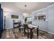 Elegant dining room featuring stylish decor, modern lighting, and an open view to the kitchen at 7790 Caswell Rd, Stanley, NC 28164