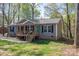 Charming single-story home with a welcoming front porch and blue front door at 7790 Caswell Rd, Stanley, NC 28164