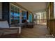 Relaxing front porch adorned with wicker chairs, offering a comfortable outdoor living space at 7790 Caswell Rd, Stanley, NC 28164