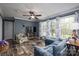 Comfortable living room featuring hardwood floors, stylish seating, and inviting decor and natural light at 7790 Caswell Rd, Stanley, NC 28164
