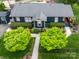 Aerial view of the property, featuring a well-maintained roof, verdant landscaping, and inviting walkway at 803 Catawba St, Belmont, NC 28012