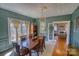 Charming dining room with coffered ceiling, chandelier and view into the living room at 803 Catawba St, Belmont, NC 28012