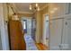 Inviting entryway with hardwood floors and a charming view into the home at 803 Catawba St, Belmont, NC 28012