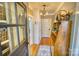 Entryway with hardwood floors, built-in storage, and decorative light fixtures at 803 Catawba St, Belmont, NC 28012