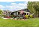 Charming home featuring a beautifully landscaped front yard with colorful flowers and inviting front porch at 803 Catawba St, Belmont, NC 28012