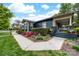 Beautiful front yard with vibrant landscaping, charming front porch, and walkway leading to the inviting entrance at 803 Catawba St, Belmont, NC 28012