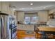 Well-equipped kitchen with granite countertops, stainless steel appliances and lots of natural light at 803 Catawba St, Belmont, NC 28012
