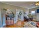 Cozy living room featuring hardwood floors, stylish bookcase, and comfortable seating area at 803 Catawba St, Belmont, NC 28012