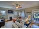 Cozy living room with a brick fireplace, hardwood floors, and ample natural light at 803 Catawba St, Belmont, NC 28012