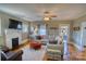 Inviting living room with a classic fireplace, hardwood floors, and comfortable seating arrangement at 803 Catawba St, Belmont, NC 28012
