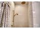 Shower featuring subway tile and bronze shower head at 803 Catawba St, Belmont, NC 28012
