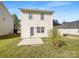 Level backyard featuring a concrete patio and grass area, perfect for outdoor activities at 808 Raindrops Rd, Gastonia, NC 28054