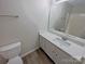 Bright bathroom features a white vanity with modern fixtures and a clean, functional design at 808 Raindrops Rd, Gastonia, NC 28054