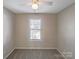 Bedroom featuring neutral walls, carpet flooring, and a window with blinds at 808 Raindrops Rd, Gastonia, NC 28054