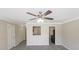 Dining area features wood-look tile flooring, crown molding, and a pass-through to the kitchen at 808 Raindrops Rd, Gastonia, NC 28054