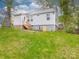 Backyard view featuring a well-maintained lawn and the home's exterior at 809 N Ransom St, Gastonia, NC 28052