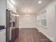 Bright dining area boasts natural light and stainless refrigerator at 809 N Ransom St, Gastonia, NC 28052