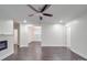Spacious living room with hardwood floors, modern ceiling fan, recessed lighting, and an electric fireplace at 809 N Ransom St, Gastonia, NC 28052