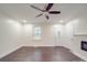 Living room showcasing hard wood floors, neutral walls, ceiling fan, and a window for natural light at 809 N Ransom St, Gastonia, NC 28052