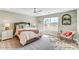 Bright bedroom with a large window and neutral decor at 8618 Frank Grier Rd # 58, Charlotte, NC 28215