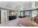 This main bedroom features a tray ceiling, natural light, and a dresser, creating a luxurious retreat at 8618 Frank Grier Rd # 58, Charlotte, NC 28215