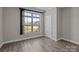 Bedroom boasting lots of natural light and wood flooring at 9087 Treetop Nw Way, Concord, NC 28027