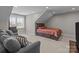 Bedroom with neutral walls, gray carpet, angled ceilings and a window at 9087 Treetop Nw Way, Concord, NC 28027