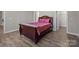Bedroom with wood-look flooring and neutral walls provides a cozy atmosphere at 9087 Treetop Nw Way, Concord, NC 28027