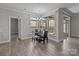 Bright dining area with large windows showcasing the outdoor scenery at 9087 Treetop Nw Way, Concord, NC 28027
