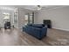 Well-lit living space offering wood floors and access to the balcony at 9087 Treetop Nw Way, Concord, NC 28027