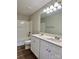 Bright bathroom featuring a double sink vanity and a tub shower combination at 9419 Seamill Rd, Charlotte, NC 28278