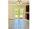 Bright dining area features a tiled floor and double doors leading to outdoor space at 9419 Seamill Rd, Charlotte, NC 28278