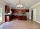 The kitchen showcases an island and updated stainless steel appliances at 9419 Seamill Rd, Charlotte, NC 28278