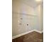 Functional laundry room includes tile floors and convenient shelving at 9419 Seamill Rd, Charlotte, NC 28278