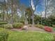 Lush backyard featuring mature trees and landscaping at 9539 Errington Ln, Mint Hill, NC 28227