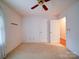 Bedroom with ceiling fan and double doors to closet or bathroom at 9539 Errington Ln, Mint Hill, NC 28227