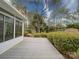 Outdoor deck area with lush landscaping and partial view of the home's exterior at 9539 Errington Ln, Mint Hill, NC 28227