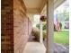 Inviting front porch adorned with colorful flowers and an American flag at 9539 Errington Ln, Mint Hill, NC 28227