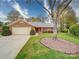 Charming brick home featuring a manicured lawn and attached two-car garage at 9539 Errington Ln, Mint Hill, NC 28227