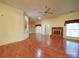 Expansive living room featuring hardwood floors, a brick fireplace and recessed lighting at 9539 Errington Ln, Mint Hill, NC 28227