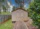 Storage shed in the backyard with weathered ramp at 9539 Errington Ln, Mint Hill, NC 28227